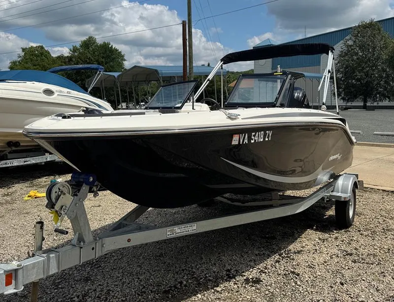 Slide: The Image of 2023 Bayliner Element M17 boat on trailer, parked outdoors. - 3