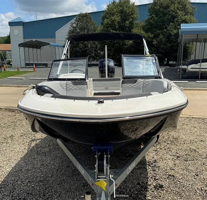 Slide: The Image of 2023 Bayliner Element M17 boat on trailer, parked outdoors. - 4