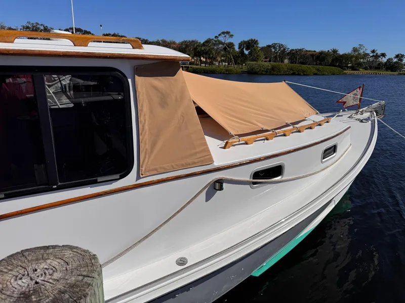 Slide: The Image of 1987 West Bay James Beal 31 Hardtop Lobster Boat docked on a sunny day. - 18