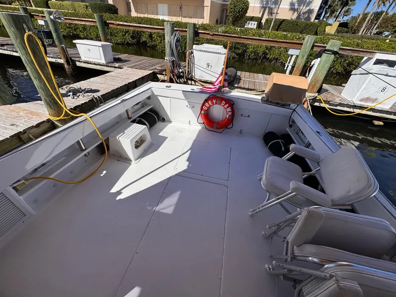 Slide: The Image of 1987 West Bay James Beal 31 Hardtop Lobster Boat docked, featuring spacious deck and seating. - 21