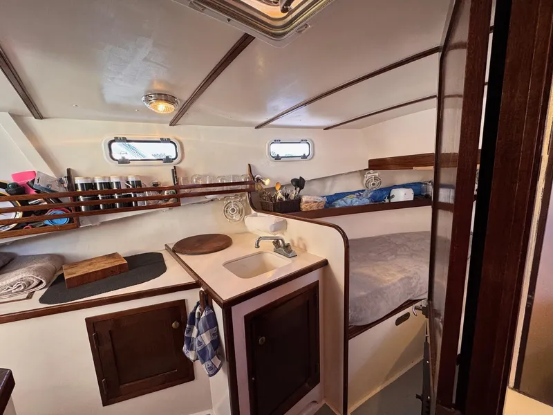 Slide: The Image of Cozy cabin interior of 1987 West Bay James Beal 31 Hardtop Lobster Boat. - 4