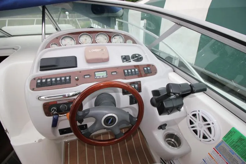 Slide: The Image of 2006 Chaparral Signature 290 helm with gauges, controls, and steering wheel. - 12