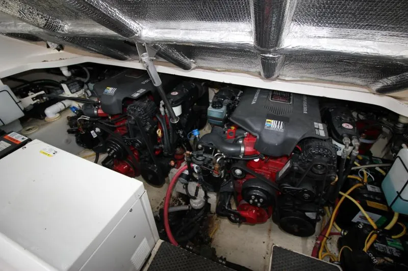 Slide: The Image of Engine compartment of a 2006 Chaparral Signature 290 boat, showcasing dual engines. - 23