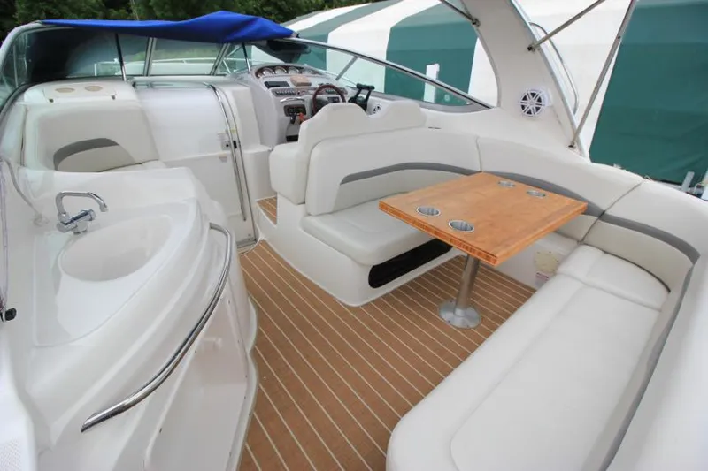 Slide: The Image of 2006 Chaparral Signature 290 boat interior with seating, table, and helm. - 5