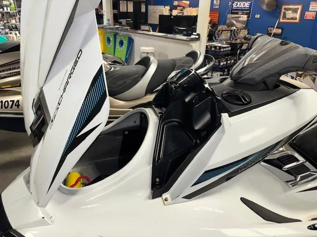 Slide: The Image of 2015 Yamaha WaveRunner FX Cruiser SVHO in showroom, showcasing open storage compartment. - 11