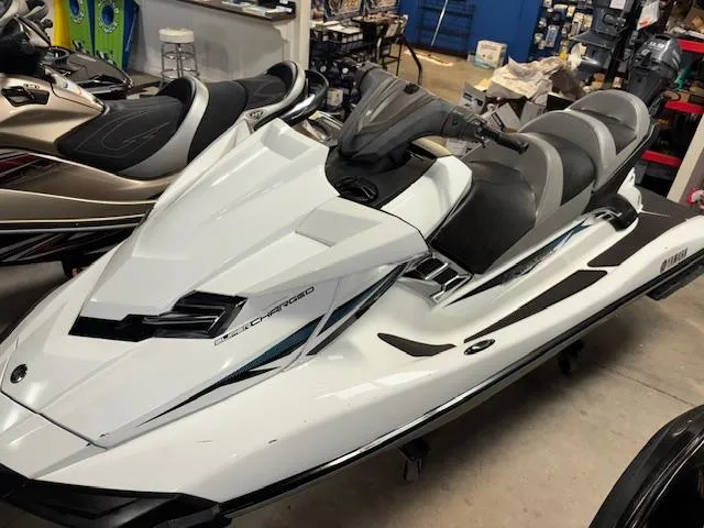 Slide: The Image of 2015 Yamaha WaveRunner FX Cruiser SVHO in showroom, white with sleek design. - 13