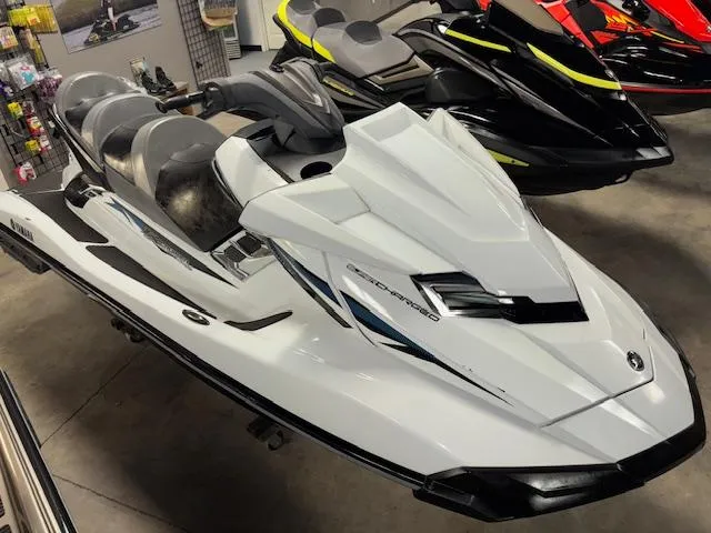 Slide: The Image of 2015 Yamaha WaveRunner FX Cruiser SVHO in showroom, white with sleek design and comfortable seating. - 14