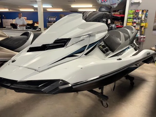 Slide: The Image of 2015 Yamaha WaveRunner FX Cruiser SVHO in showroom, white with sleek design. - 3
