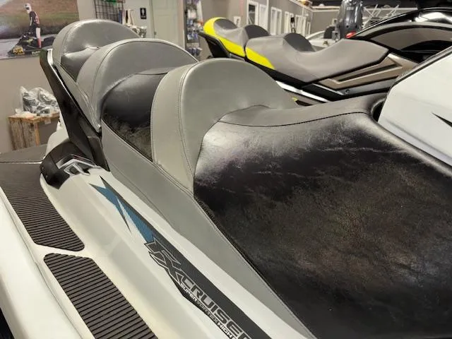 Slide: The Image of 2015 Yamaha WaveRunner FX Cruiser SVHO with sleek black and gray seating in showroom. - 9