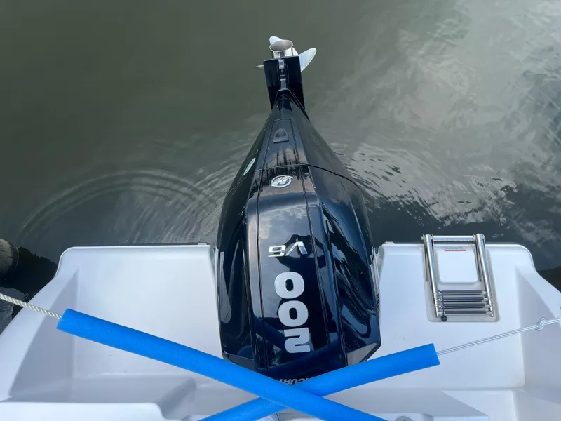 Slide: The Image of 2024 Aquasport 2200 Dual Console boat with powerful 200 HP outboard motor. - 6