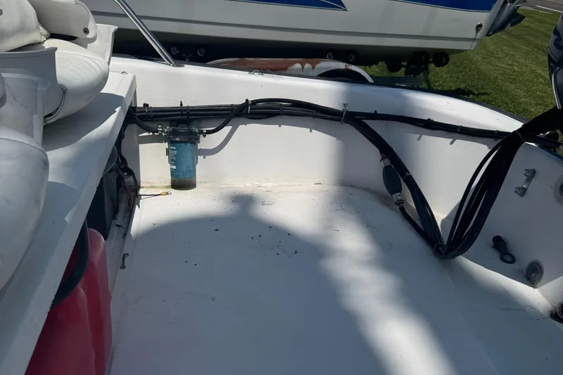 Slide: The Image of Interior view of a 2000 Boston Whaler Sport 13 boat, showing wiring and components. - 4