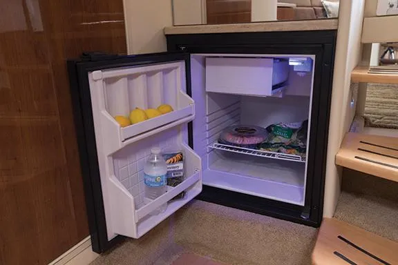 Slide: The Image of Manufacturer Provided Image: Open mini fridge in 2015 Formula 370 Super Sport boat interior. - 17