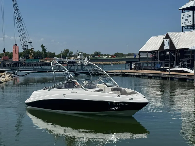 Slide: The Image of 2007 Yamaha AR230 HO boat docked at Sapphire Bay Marina. - 2