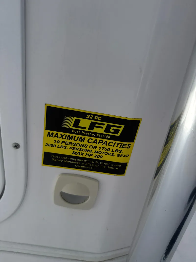 Slide: The Image of 2023 Aquasport 2200 Center Console capacity label, maximum 10 persons or 1750 lbs, 200 HP. - 8