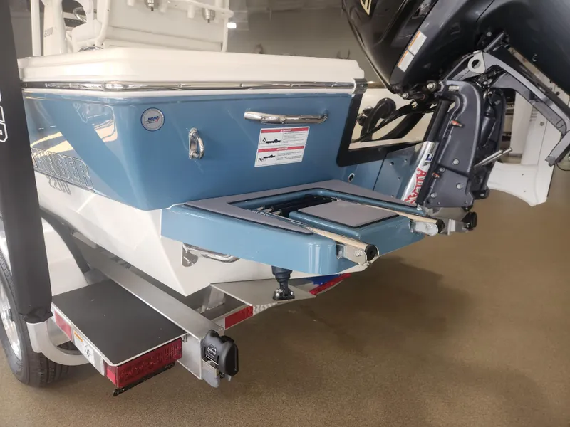 Slide: The Image of 2025 Pathfinder 2200 TRS boat rear view with motor and trailer. - 10