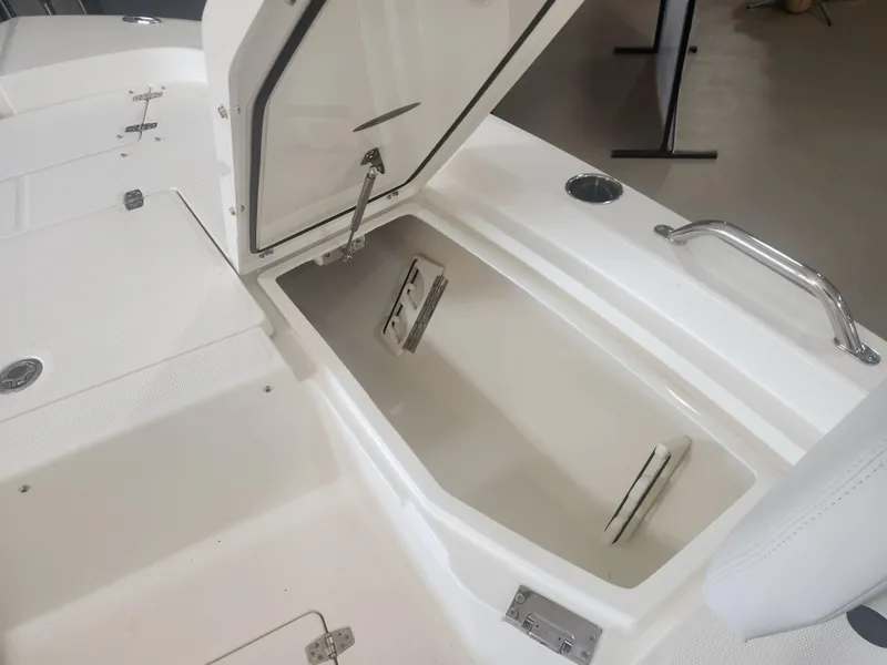Slide: The Image of Open storage compartment on a 2025 Pathfinder 2200 TRS boat, showcasing interior space. - 14