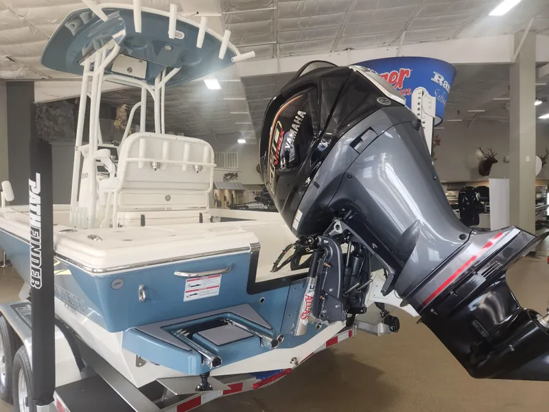Slide: The Image of 2025 Pathfinder 2200 TRS boat with Yamaha outboard motor in showroom. - 4
