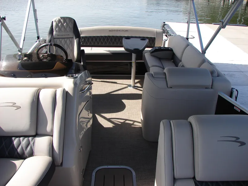 Slide: The Image of 2019 Bennington Q 25 QSBIO pontoon boat interior with luxurious seating and helm. - 16
