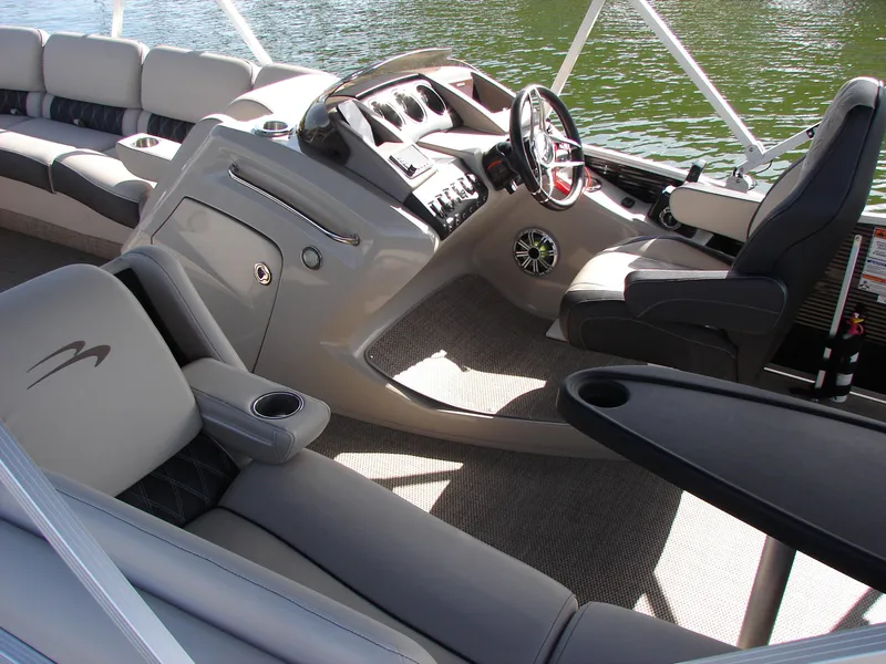 Slide: The Image of Luxurious interior of 2019 Bennington Q 25 QSBIO pontoon boat with plush seating and helm. - 17