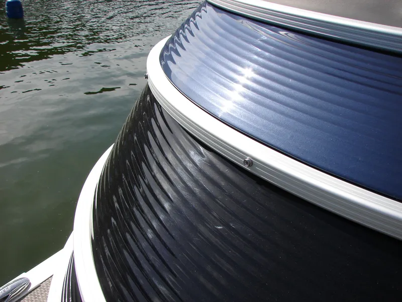 Slide: The Image of 2019 Bennington Q 25 QSBIO boat with sleek, reflective exterior on water. - 18