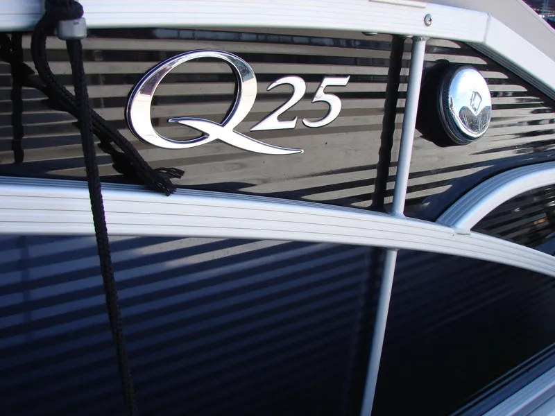 Slide: The Image of 2019 Bennington Q 25 QSBIO boat logo on sleek black exterior. - 22