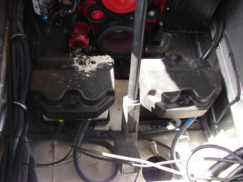 Slide: The Image of Engine compartment of a 2019 Bennington Q 25 QSBIO boat, showing components and wiring. - 25