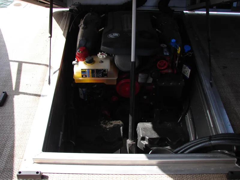 Slide: The Image of Engine compartment of a 2019 Bennington Q 25 QSBIO boat, showing mechanical components. - 26