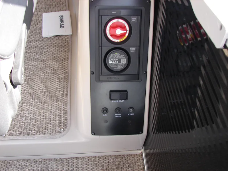 Slide: The Image of Control panel on 2019 Bennington Q 25 QSBIO boat with switches and Simrad manual. - 27