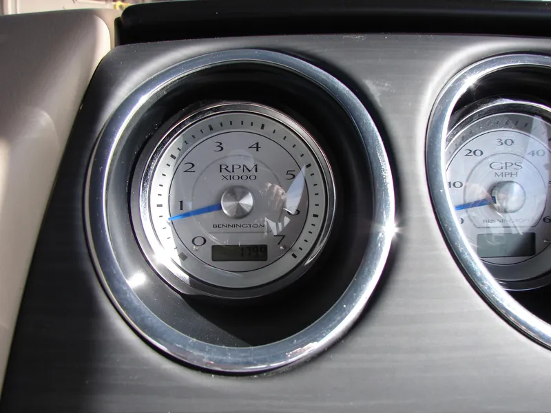 Slide: The Image of Close-up of 2019 Bennington Q 25 QSBIO RPM gauge, displaying 1799 RPM. - 33