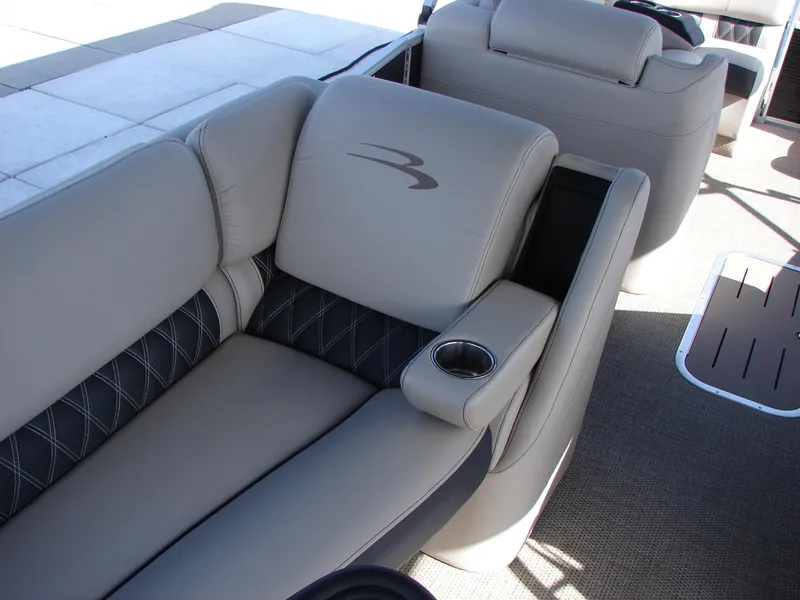 Slide: The Image of 2019 Bennington Q 25 QSBIO boat interior with luxurious seating and cup holder. - 37