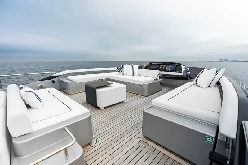 Slide: The Image of Luxurious deck of 2021 Riva 88' FOLGORE yacht with modern seating and ocean view. - 21