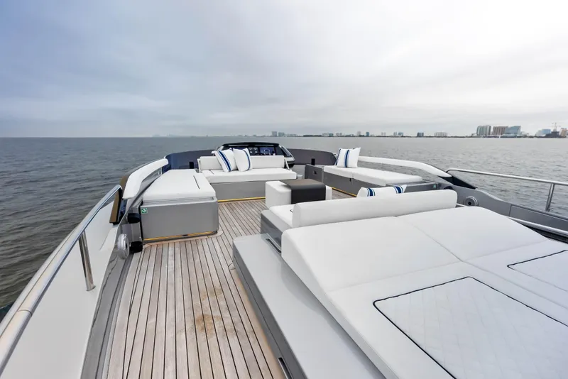 Slide: The Image of Luxurious deck of 2021 Riva 88' FOLGORE yacht with modern seating and ocean view. - 24