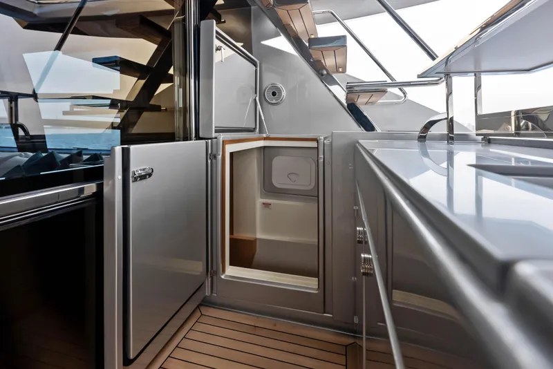 Slide: The Image of Modern kitchen area on the 2021 Riva 88' FOLGORE yacht with stainless steel appliances. - 26