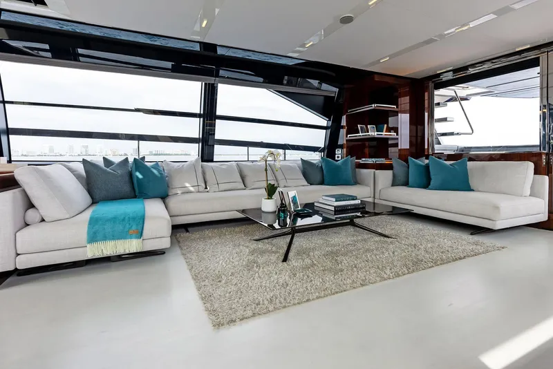 Slide: The Image of Luxurious interior of 2021 Riva 88' FOLGORE yacht with modern white sofas and large windows. - 27