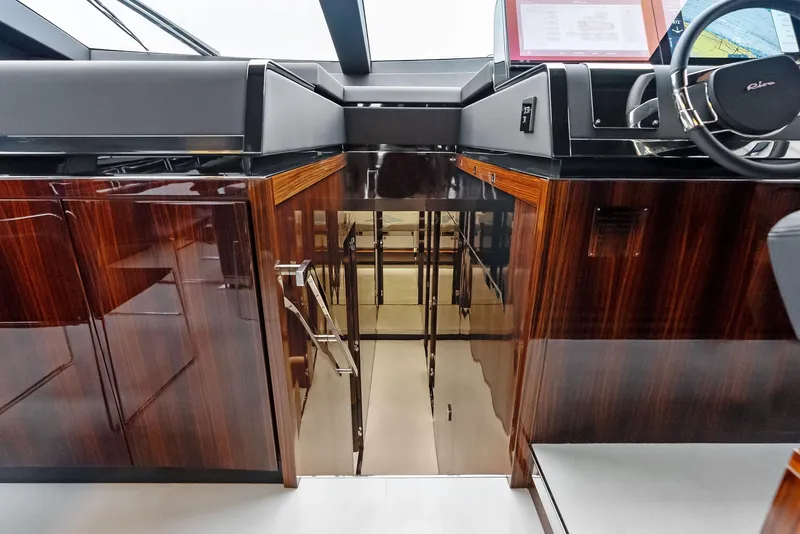 Slide: The Image of Interior of 2021 Riva 88' FOLGORE yacht with polished wood finishes. - 35