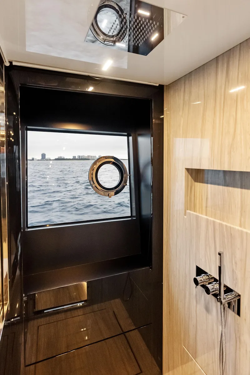 Slide: The Image of Modern bathroom on the 2021 Riva 88' FOLGORE yacht with ocean view. - 43