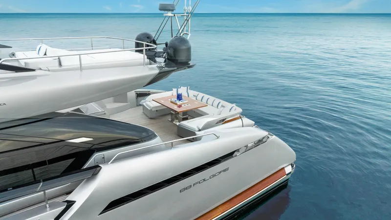 Slide: The Image of Luxury Riva 88 Folgore yacht, 2021 model, docked on serene ocean waters. - 5