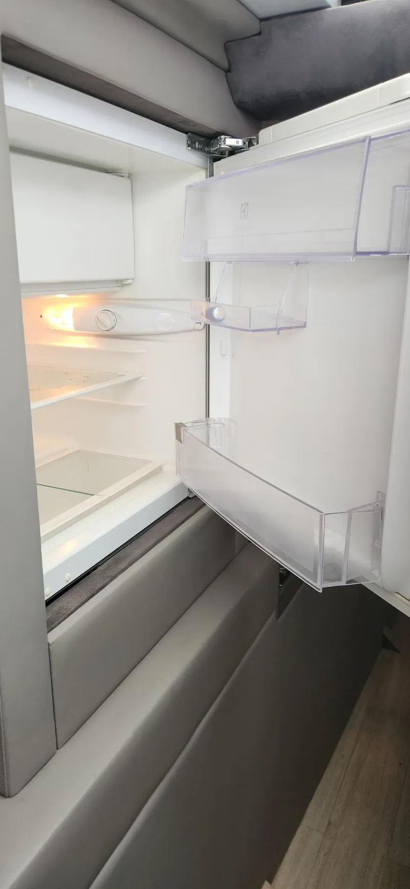 Slide: The Image of Open Trident Custom refrigerator, 2017 model, with empty shelves and door compartments. - 10