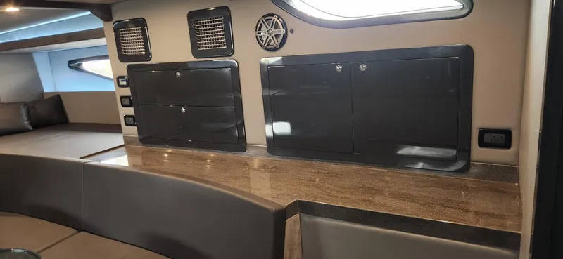 Slide: The Image of Interior of a 2017 Trident Custom boat with sleek cabinets and modern design. - 12