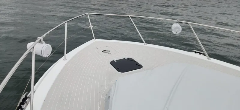 Slide: The Image of Bow of 2017 Trident Custom boat with speakers, railing, and ocean view. - 16