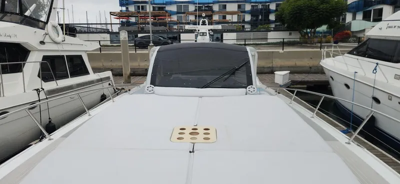 Slide: The Image of Luxury Trident Custom 2017 yacht docked at marina, surrounded by other boats. - 2