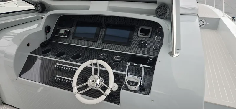 Slide: The Image of Control panel of a 2017 Trident Custom boat with modern navigation equipment. - 20