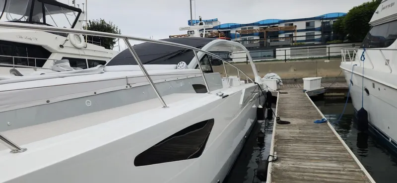 Slide: The Image of Luxury 2017 Trident Custom yacht docked at marina with modern design. - 25