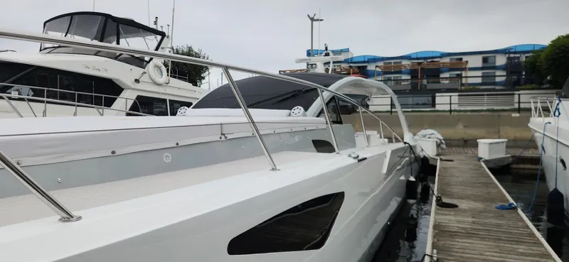 Slide: The Image of Luxury Trident Custom 2017 yacht docked at marina, showcasing sleek design and modern features. - 27