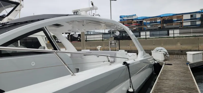 Slide: The Image of Luxury 2017 Trident Custom yacht docked at marina, showcasing sleek design and modern features. - 28