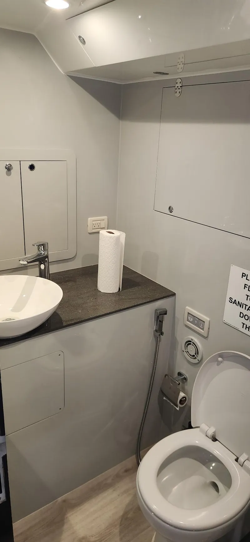 Slide: The Image of Modern Trident Custom 2017 bathroom with sink, toilet, and countertop in a compact space. - 8