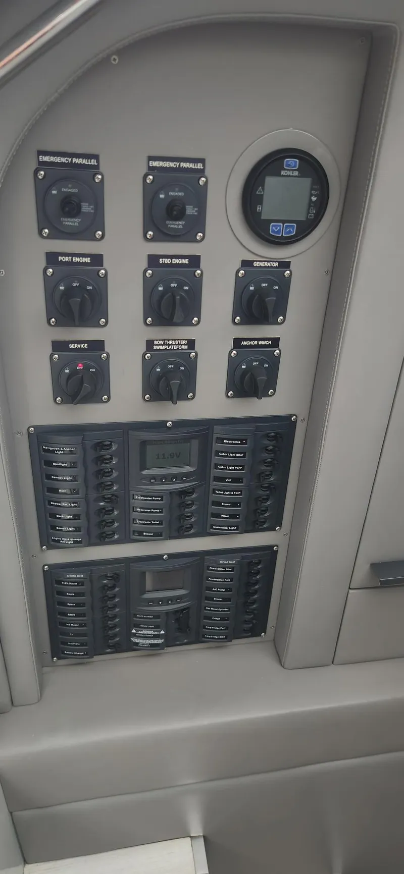 Slide: The Image of Control panel of a 2017 Trident Custom boat with switches and digital display. - 9