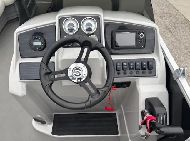 Slide: The Image of Steering console of 2021 Sylvan Mirage 820 Cruise with gauges and controls. - 11