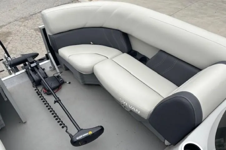 Slide: The Image of 2021 Sylvan Mirage 820 Cruise boat interior with gray seating and trolling motor. - 7