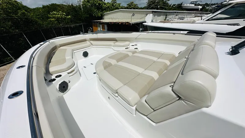 Slide: The Image of 2021 Boston Whaler 420 Outrage boat with spacious, luxurious seating area. - 13
